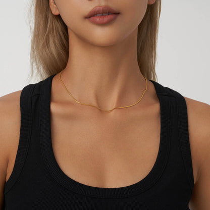 This versatile gold-tone round snake chain is silky and soft, which is perfect for layering with other necklaces.